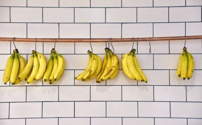 bananas hanging on hooks